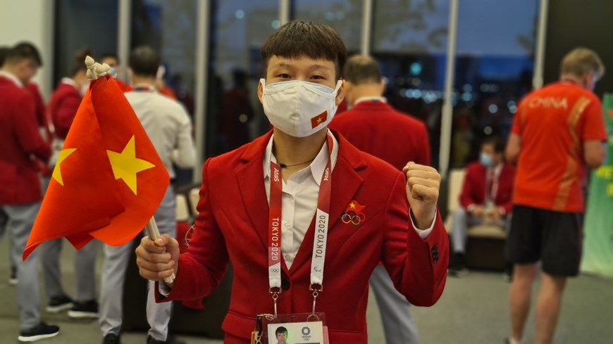Hình ảnh Đoàn thể thao Việt Nam diễu hành ở lễ khai mạc Olympic Tokyo